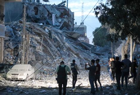 Journalists inspect the damage to Gaza City following bombing by the Israeli army.