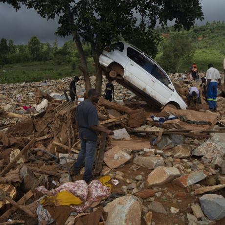 Community members sort through the rubble and damage left by Cyclone Idai in Ngangu township, Chimanimani, Zimbabwe. 23 March 2019.