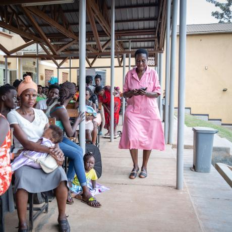 A nurse tending to patients in a health centre