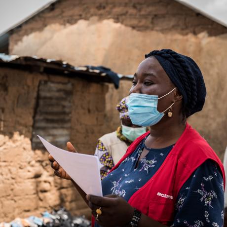 A woman responder wearing a protective face mask