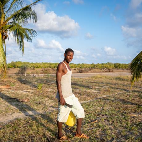 Dickson standing on his land