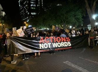 A photo of people demonstrating at the Sandton Shutdown