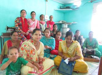 Women taking part in a village women’s right forum in India