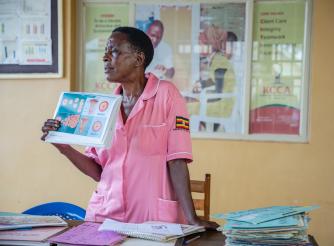 Nurse Margaret Kasolo, 57, educates women at Kawala Health Center IV in Kampala, Uganda