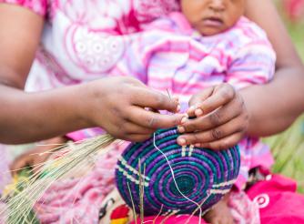 Women work together in an ActionAid supported cooperative in Rwanda.